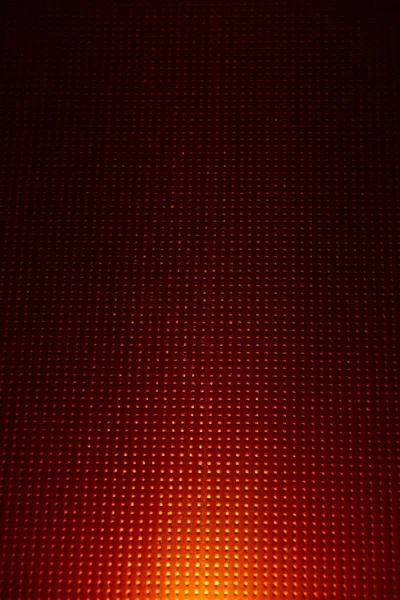 Yellow glow on a red checkered background