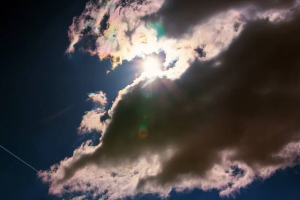 View on beautiful white and gray clouds in a blue sky. Clouds and Skies in the afternoon. The Sun behind Clouds. Fresh Air. Cloudy Weather. Cloud Formations.