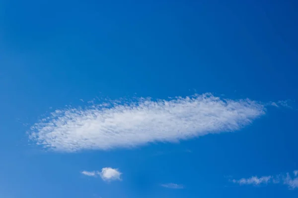 View on beautiful white clouds in a blue sky. Clouds and Skies in the Morning. The Sun behind Clouds. Fresh Air. Cloudy Weather. Cloud Formations. White Clouds