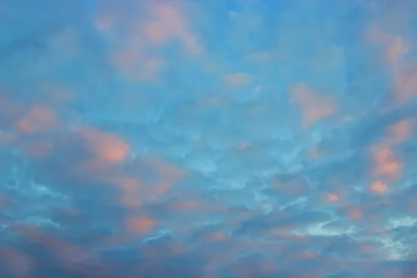 View on beautiful pink clouds in a pink blue sky. Clouds and Skies in the Morning. Fresh Air.