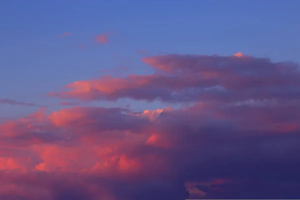 View on beautiful pink and gray clouds in a blue sky. Clouds and Skies in the Morning. Fresh Air.