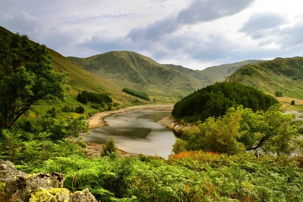 Água baixa no reservatório de Haweswater Imagens De Bancos De Imagens Sem Royalties