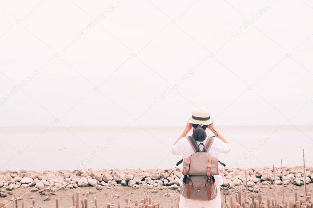 Rear view of woman with backpack