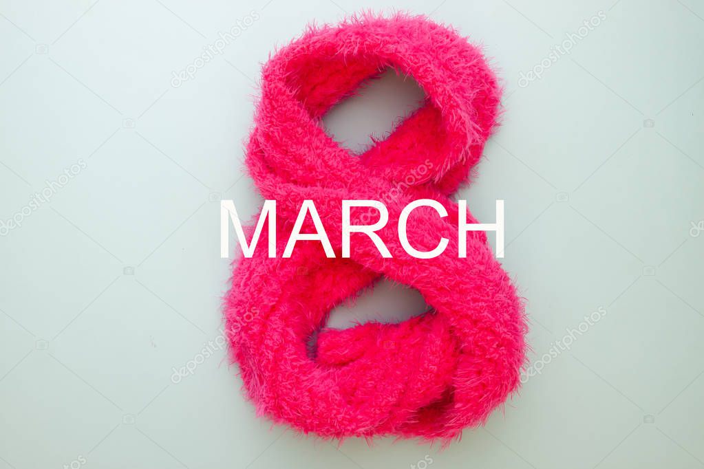 Woman's Day concept. Eight number made from pink scarf. 8th March
