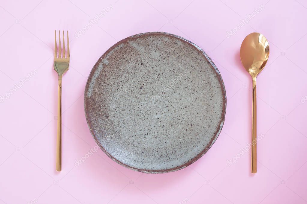 Empty plate, Table setting. Ceramic plate, spoon and fork on pin
