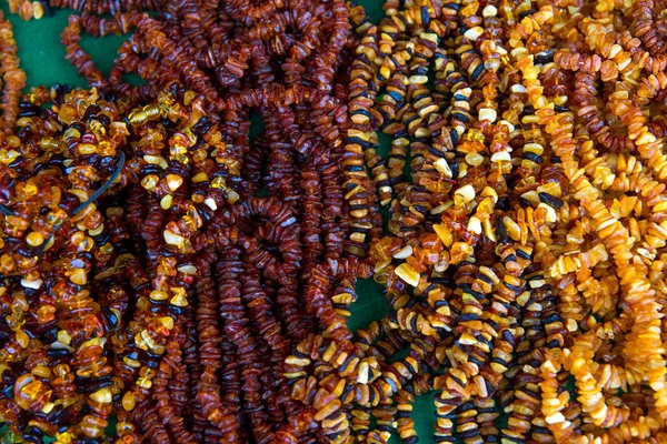 Background from amber necklaces and souvenirs — Stock Photo, Image