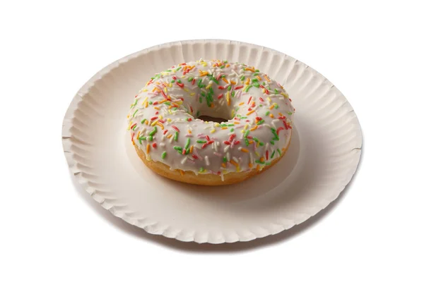 Sweet doghnut in glaze decorated with sprinkles — Stock Photo, Image