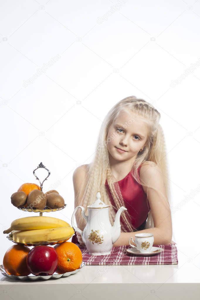 Little girl sitting at the table