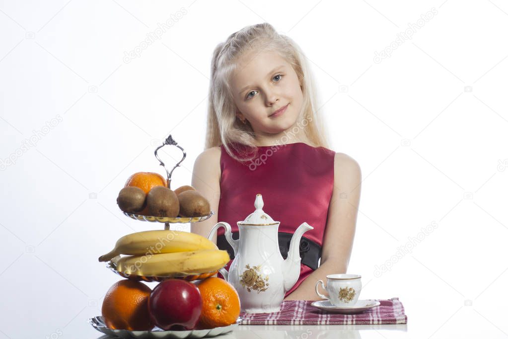 Little girl sitting at the table