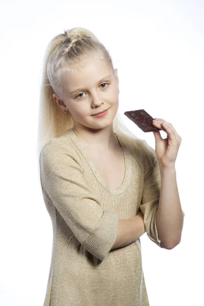 Beautiful girl eating chocolate. — Stock Photo, Image