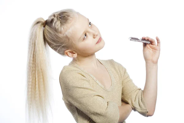 Beautiful girl eating chocolate. — Stock Photo, Image