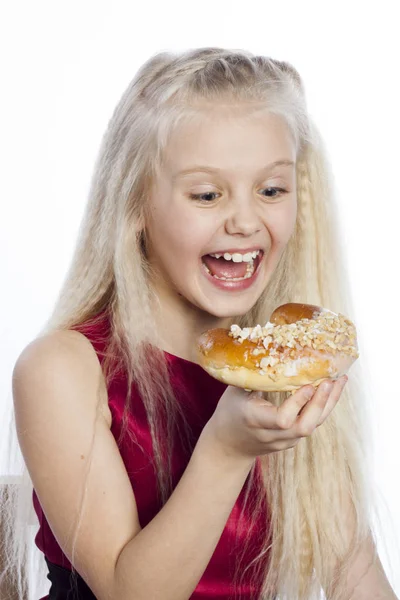 Girl looking at croissant — Stock Photo, Image