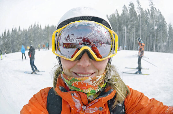 Happy woman taking selfie on winter  in Carpathian Mountains, Bukovel Stock Photo