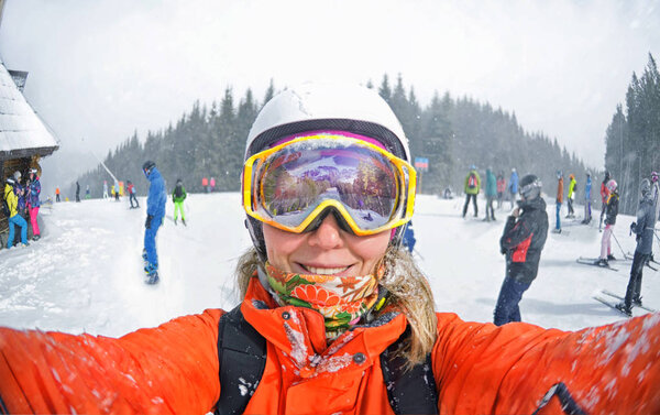 Happy woman taking selfie on winter  in Carpathian Mountains Stock Picture