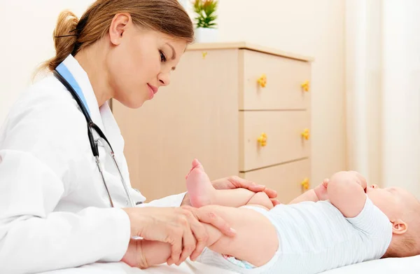 Female Orthopedist Examining Little Child Young Doctor Massaging Baby Room — Stock Photo, Image