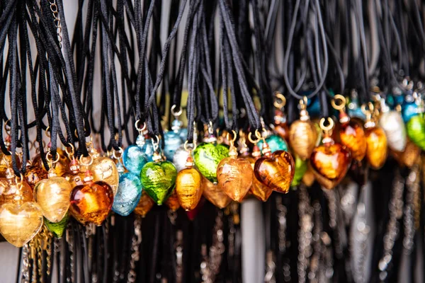 Detail of heart-shaped necklaces in Murano glass. Artistic realization typical of the Venetian island . Italy - Venice - Murano - production of the famous Murano glass.