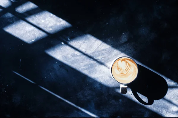 Coffee on concrete background light leak — Stock Photo, Image