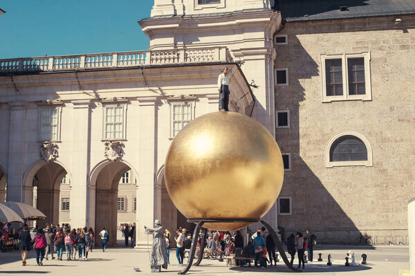 Salzburg, Austria - April 2015: Cathedral and Monument to the confectioner Paul Fuerst.