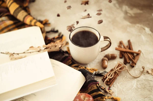 Autumn composition. Cup of coffee, blanket, autumn leaves, cinnamon sticks on beige background. Flat lay, top view. — Stock Photo, Image