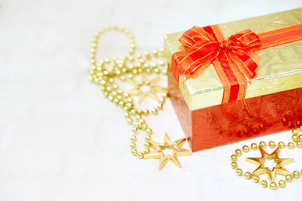 Top view color gift box with ribbon on white wooden plank background