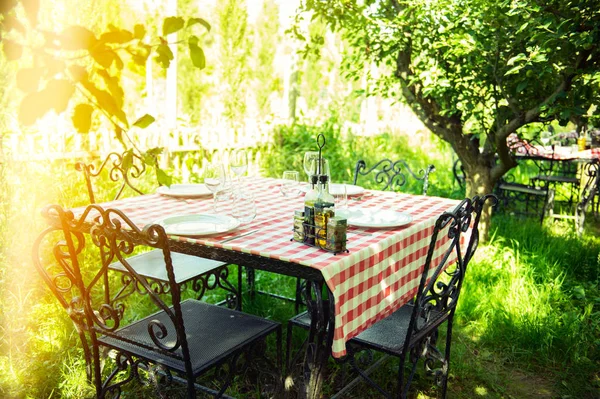 Table is set and waiting for dining in the countryside