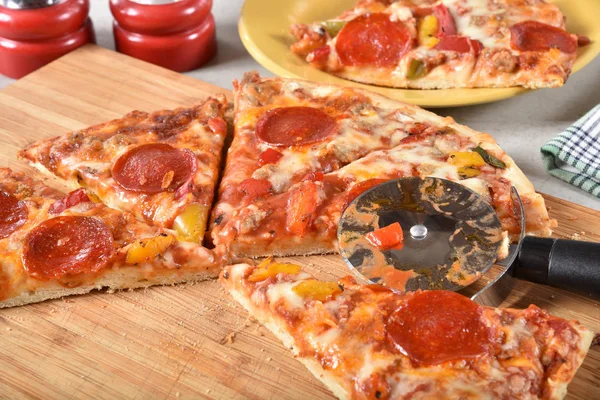 Fresh Hot Sliced Pepperoni Sausage Pizza Cutting Board — Stock Photo, Image