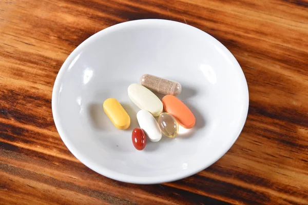 Multi vitamin and mineral tablets in a dish