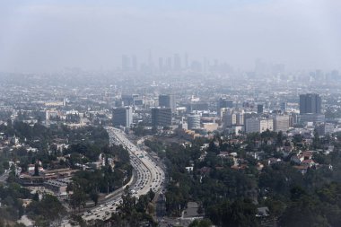 The Los Angeles skyline barely visible through thick smog clipart