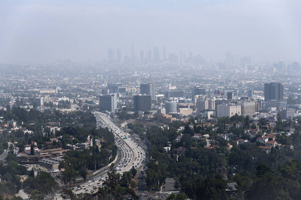 The Los Angeles skyline barely visible through thick smog