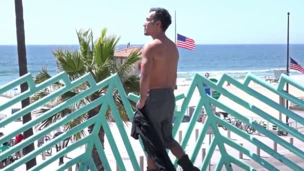 Handsome Shirtless Asian Man Overlooking Ocean — Stock Video