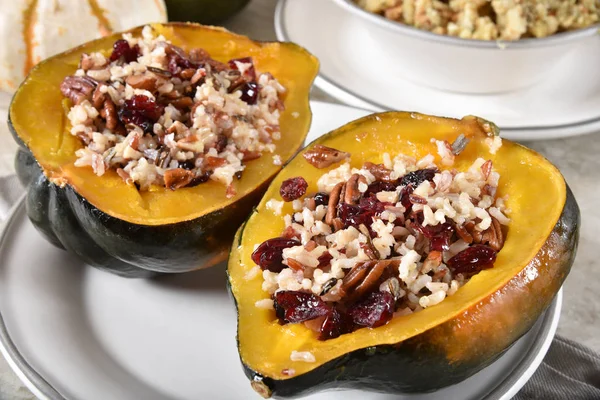 Baked acorn squash stuffed with wild rice, quinoa, dried cranberry and pecans.