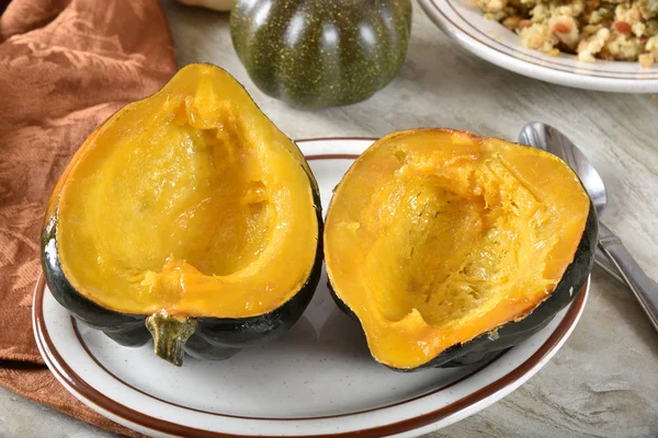 Steaming hot baked acorn squash halves with a maple butter glaze