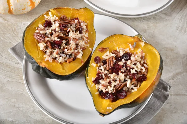 Fresh baked acorn squash stuffed with wildrice, quinoa, pecans and dried cranberries.