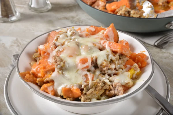 Bowl of ground turkey with sweet potatoes and mozzarella cheese
