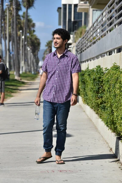 Happy Young Man Walking Palm Tree Lined Beach Path — Stock Photo, Image