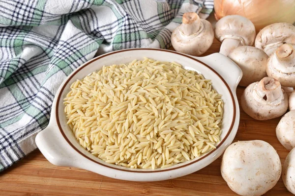 Bowl Raw Orzo Pasta Button Mushrooms Onion — Stock Photo, Image