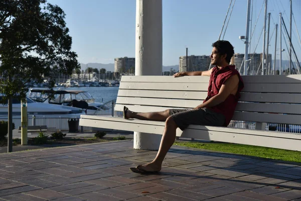 Handsome Young Man Sitting Bench Looking Marina Late Afternoon Sunlight — Stock Photo, Image