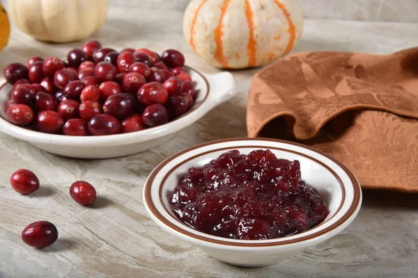 Small dish of fresh cranberry sauce with fresh cranberries