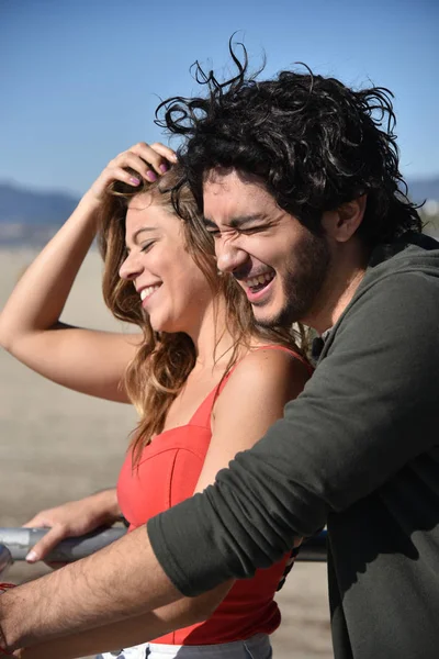 Young couple laughing outdoors