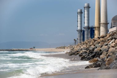 Smoke stacks of a power plant on the beach near El Segundo California