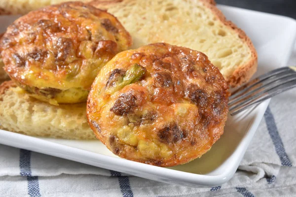 Baked sausage and cheese omelets on toast — Stock Photo, Image