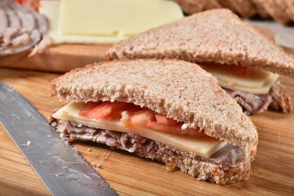 Fresh roast beef sandwich on a cutting board — Stock Photo, Image
