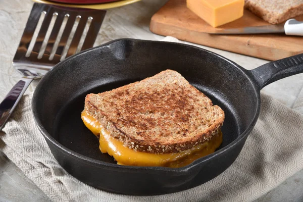 Grilled cheese sandwich in a skillet — Stock Photo, Image