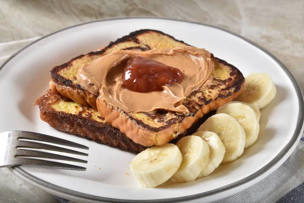 French toast with peanut butter, jelly and banana — Stock Photo, Image