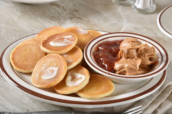 Dollar pancakes with peanut butter and jam — Stock Photo, Image