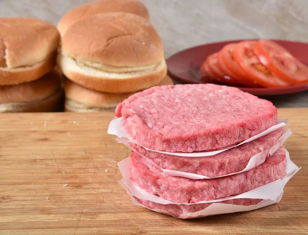 Raw hamburger patties — Stock Photo, Image