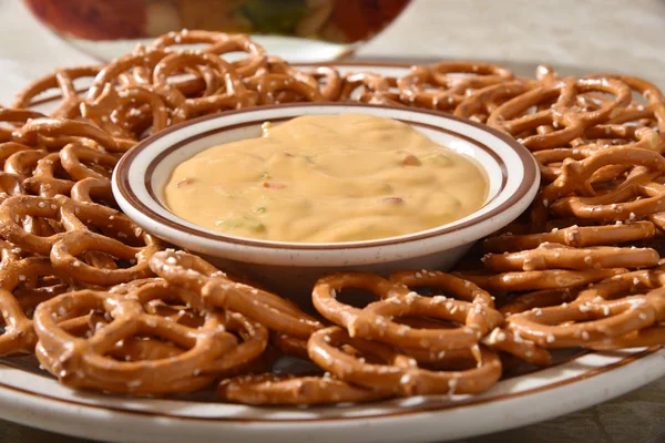 Pretzels and cheese dip — Stock Photo, Image