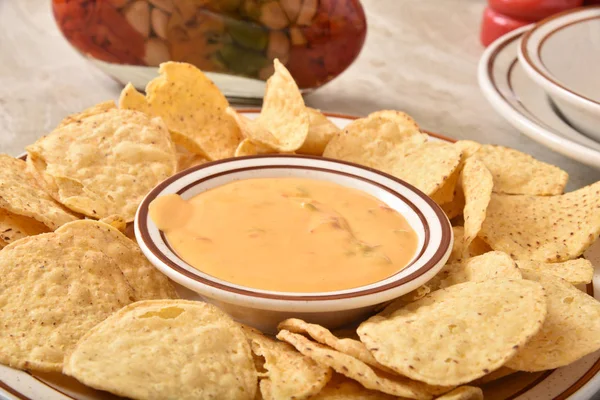 Tortilla chips with cheese sauce — Stock Photo, Image