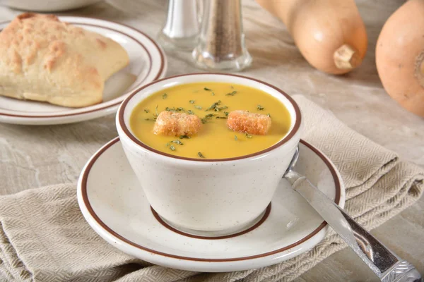 Cup of butternut squash soup with croutons — Stock Photo, Image