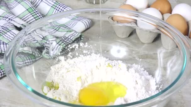 Egg Dropping Bowl Dry Ingredients Slow Motion — Stock Video